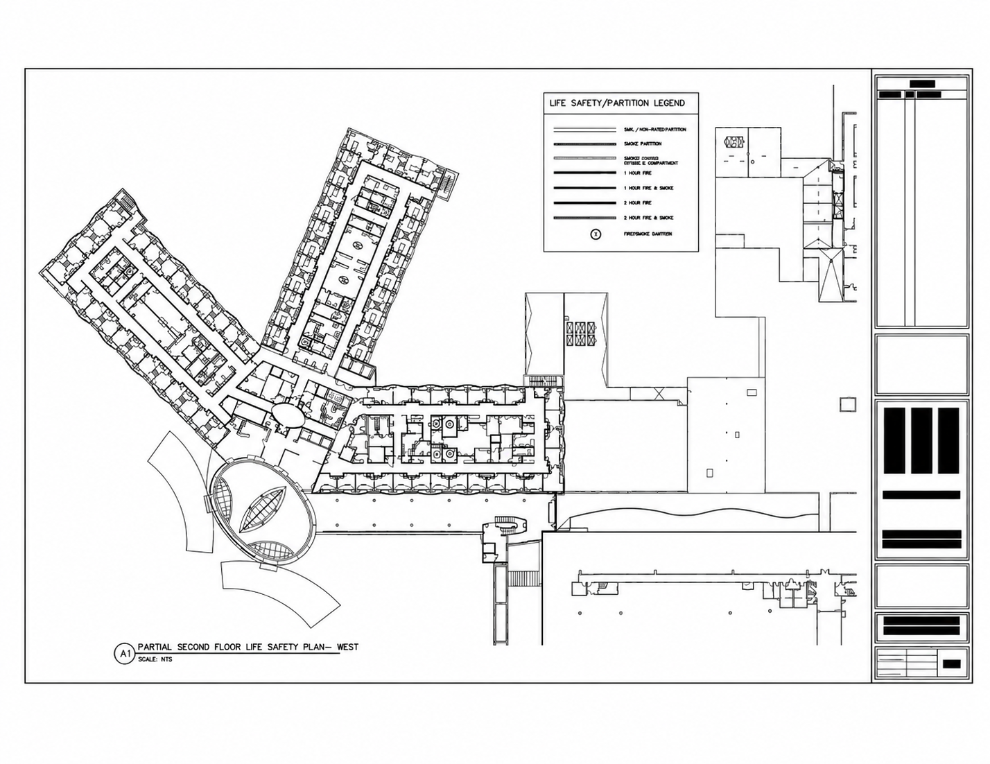 A black-and-white Life Safety Plan with no color coding — the rated assemblies are not visually distinguished from one another, so the surveyor must read every wall annotation individually instead of seeing ratings at a glance.