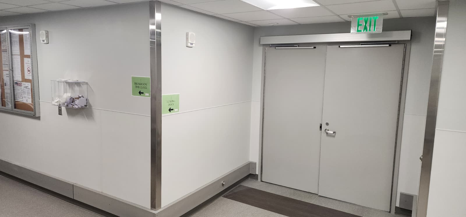 Exit door with access control hardware that appears to restrict free egress from the egress side