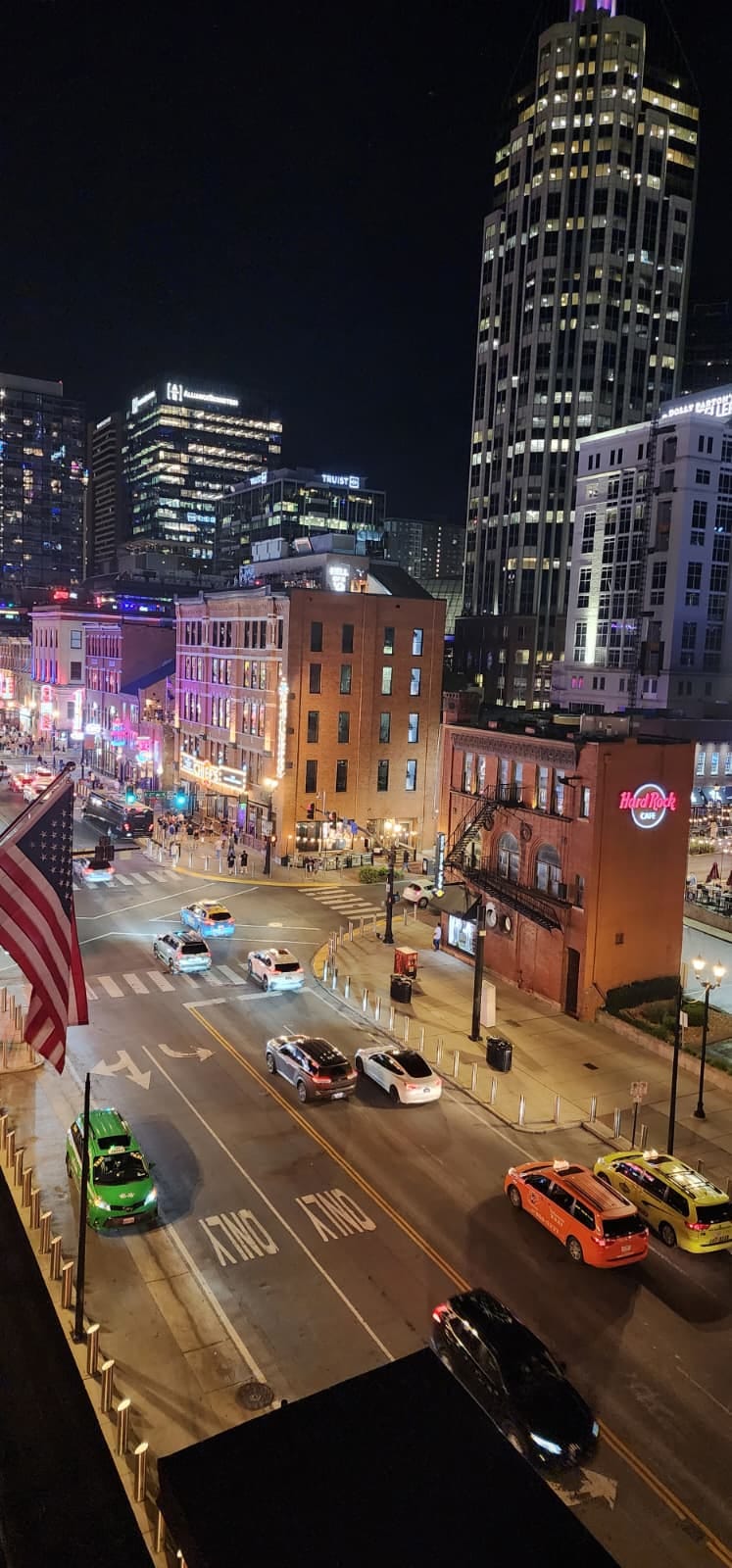 Nashville Broadway at night with neon signs and honky-tonks lit up