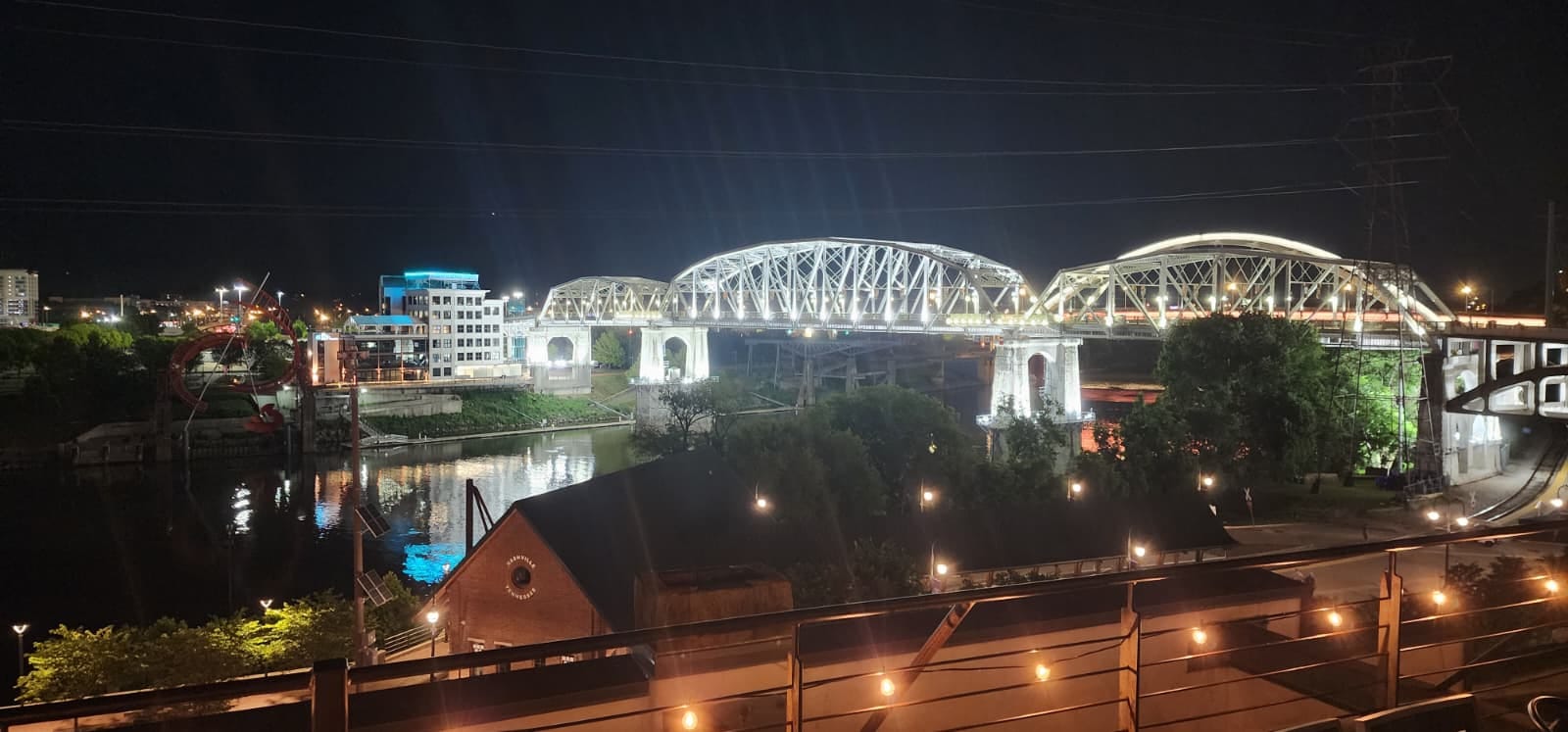 Nashville skyline at dusk with the Cumberland River in the foreground
