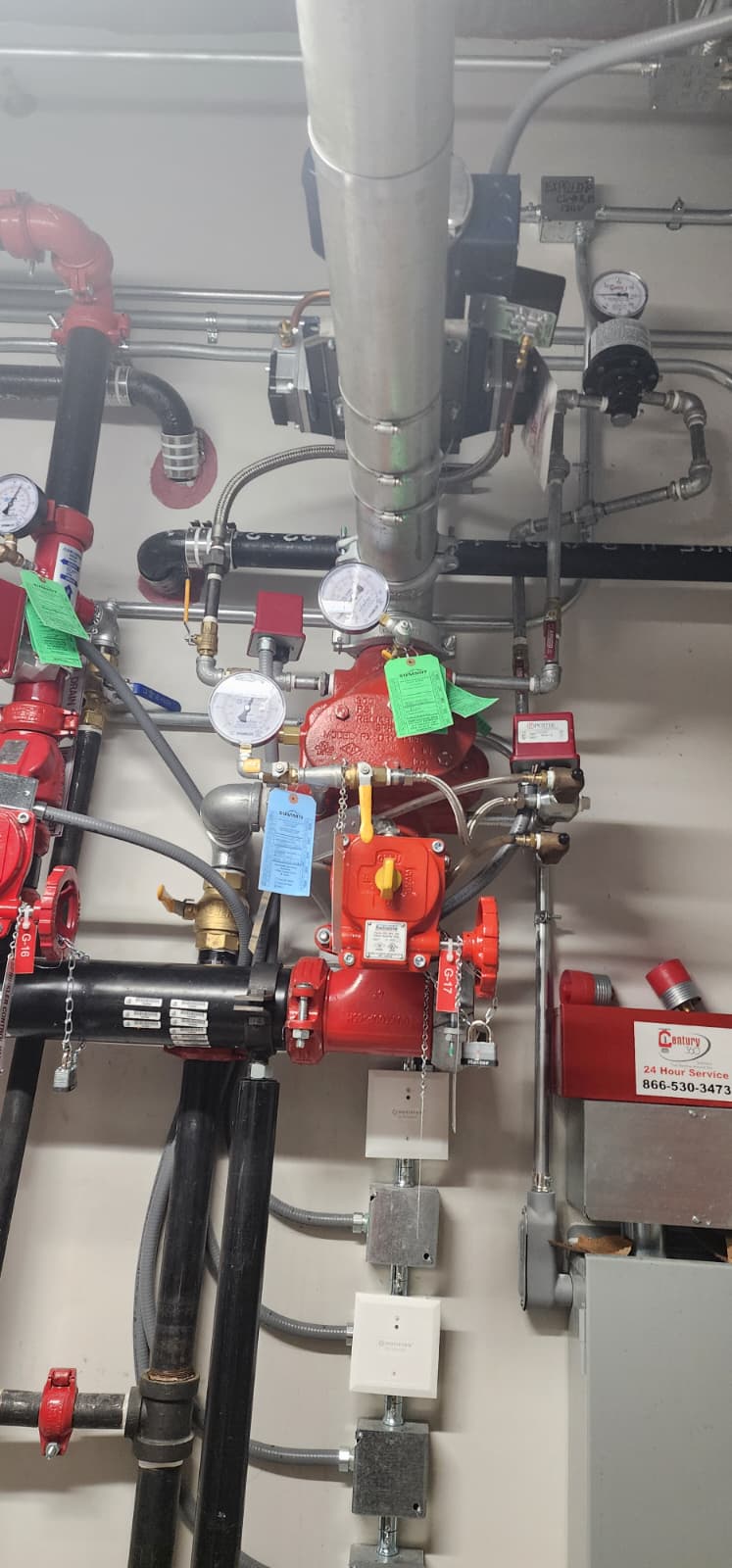 Reliable Model FX-DR dry pipe valve assembly with Model B1 accelerator, Potter pressure switch, Summit air compressor, and gauges — a complete dry system riser in service