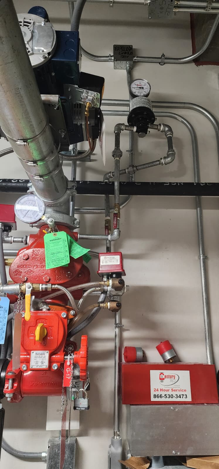 Reliable Model FX-DR dry pipe valve with Model B1 accelerator mounted on top, Potter pressure switch, gauges, and green inspection tags